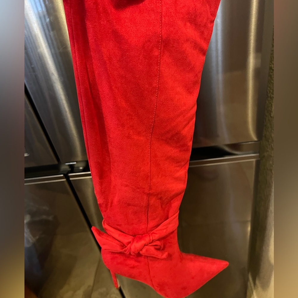 Faux suede knee high stiletto boot with accent bow